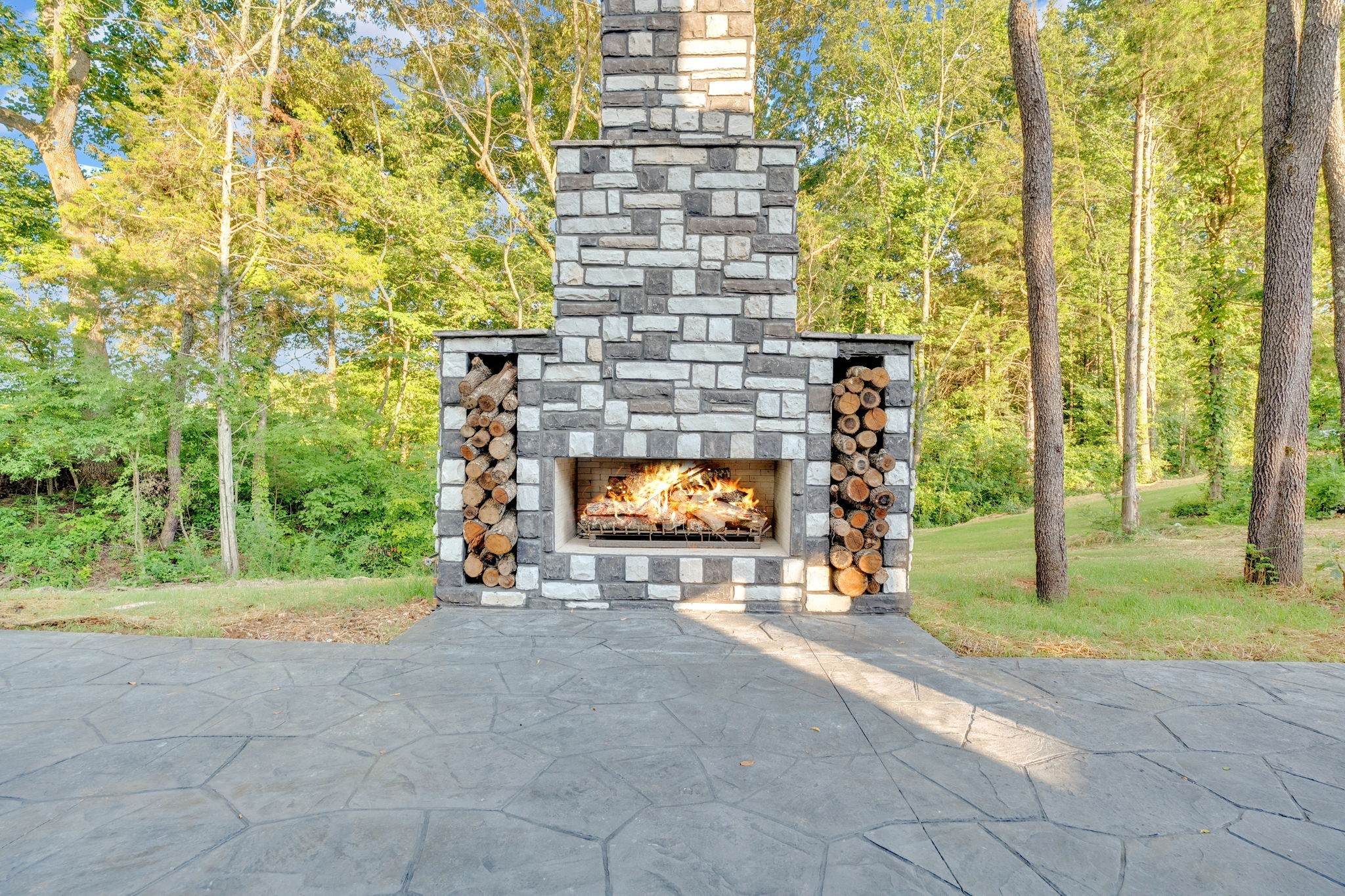 92 Ghea Road Normandy, TN 37360 - Photo 11 of 52 a view of a brick wall with two windows and a yard