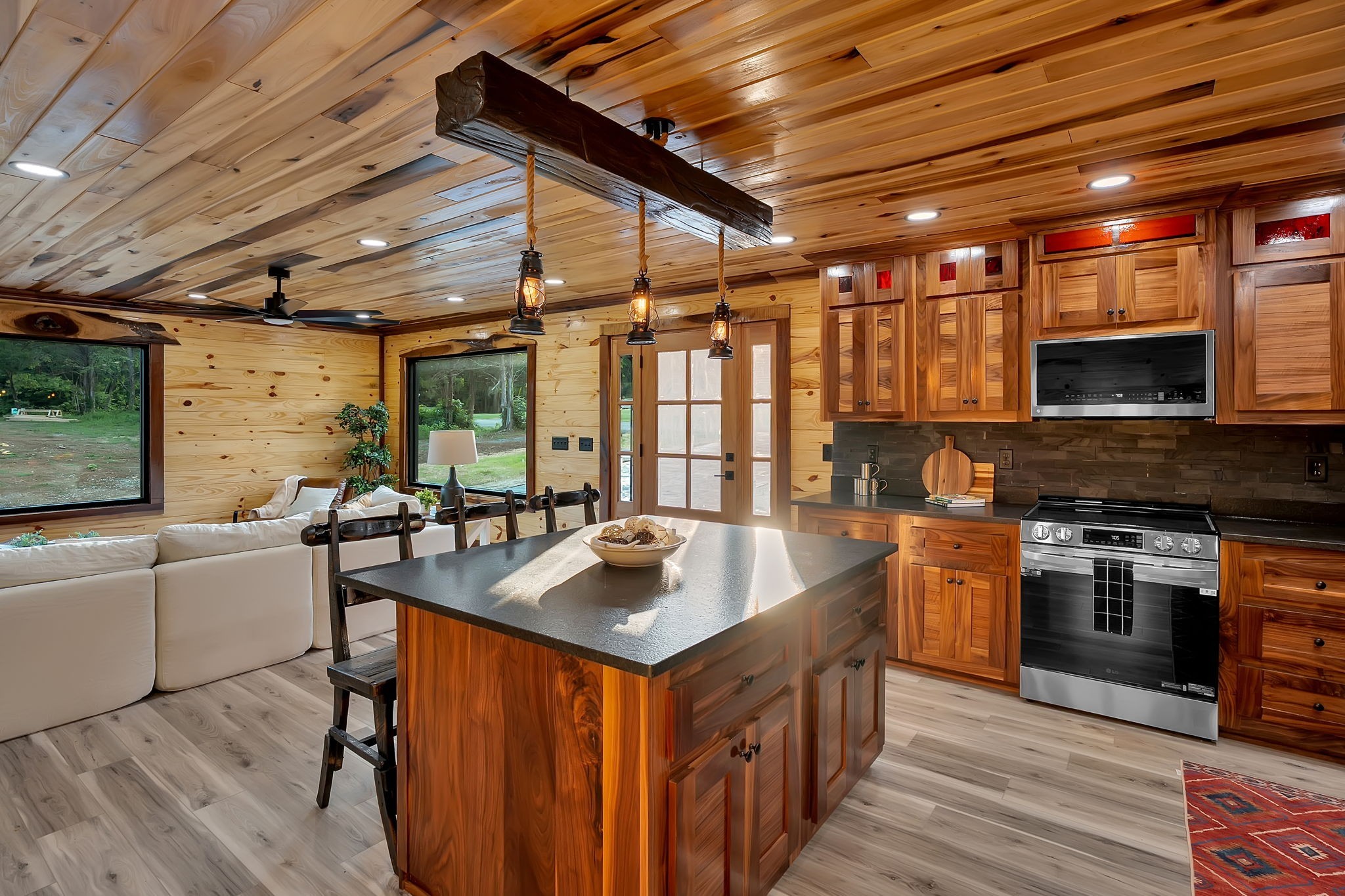 92 Ghea Road Normandy, TN 37360 - Photo 33 of 52 a kitchen with stainless steel appliances granite countertop a sink a stove and a wooden floors