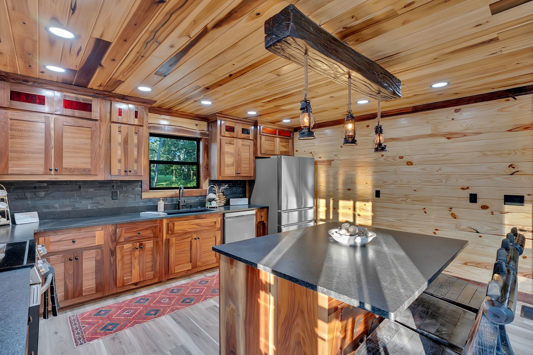92 Ghea Road Normandy, TN 37360 - Photo 34 of 52 a kitchen with a table chairs stove and cabinets