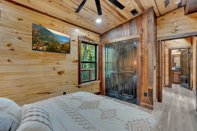 a bedroom with a bed and a dresser