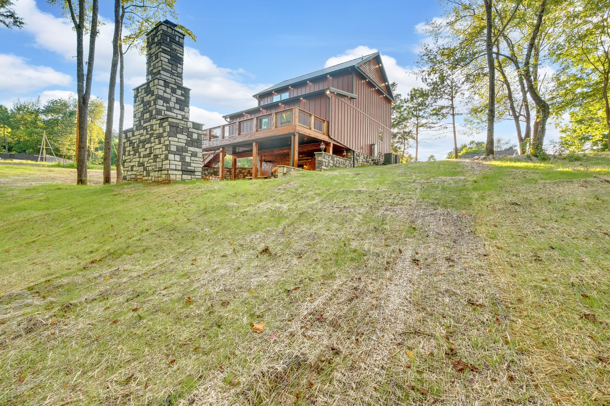 92 Ghea Road Normandy, TN 37360 - Photo 10 of 52 a view of a house with a big yard and large trees