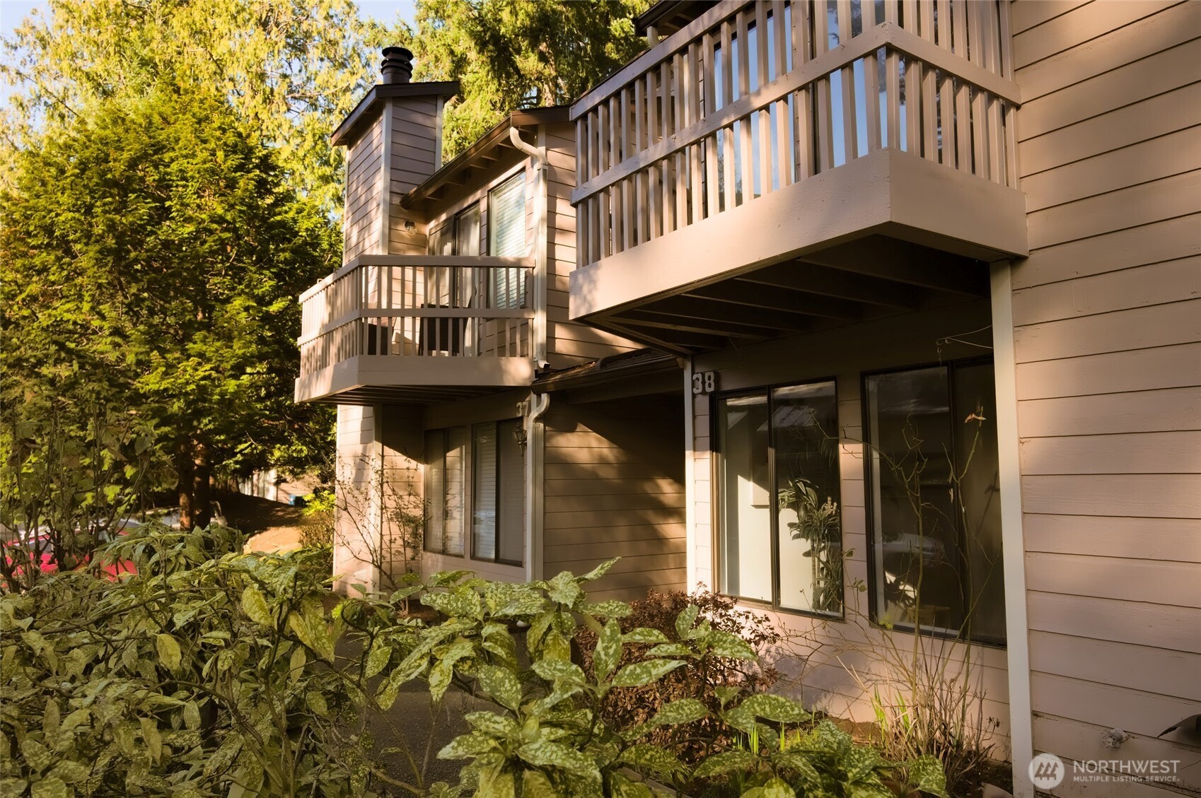 1555 Union Avenue Northeast, Unit G38 Renton, WA 98059 - Photo 1 of 18 a front view of a house with a yard
