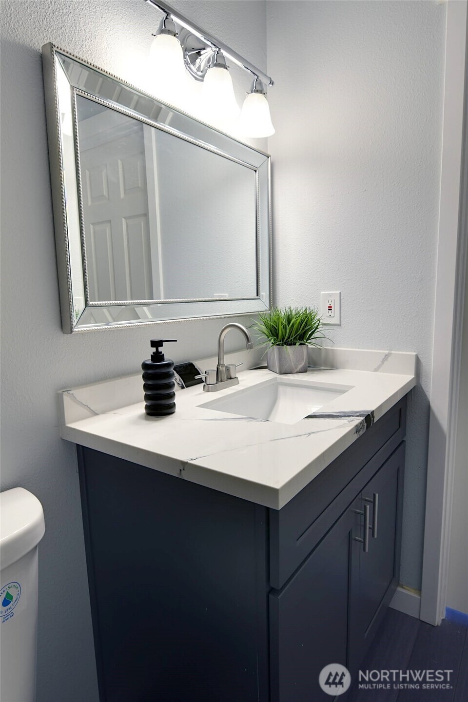 1555 Union Avenue Northeast, Unit G38 Renton, WA 98059 - Photo 12 of 18 a bathroom with a sink and a mirror