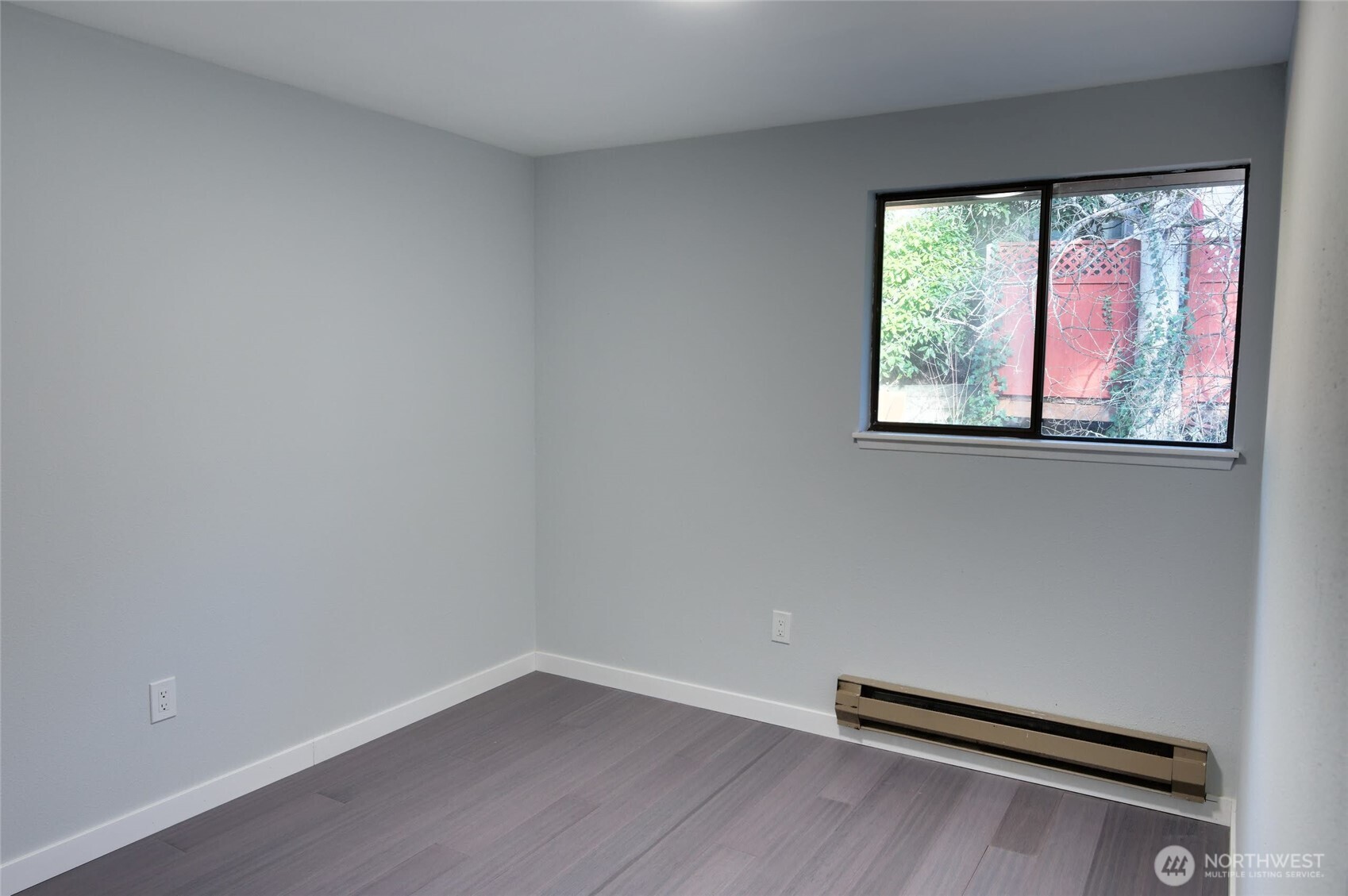1555 Union Avenue Northeast, Unit G38 Renton, WA 98059 - Photo 14 of 18 a view of a room with wooden floor and a window
