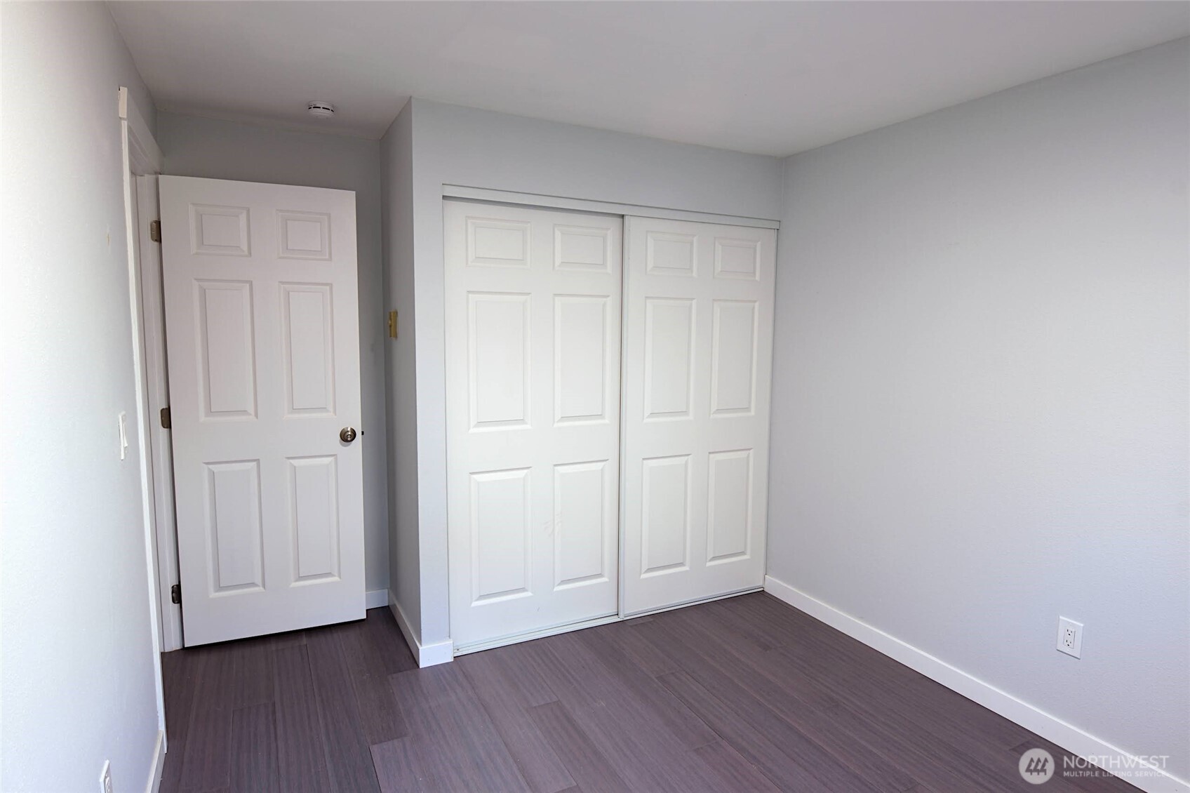 1555 Union Avenue Northeast, Unit G38 Renton, WA 98059 - Photo 15 of 18 a view of an empty room and wooden floor