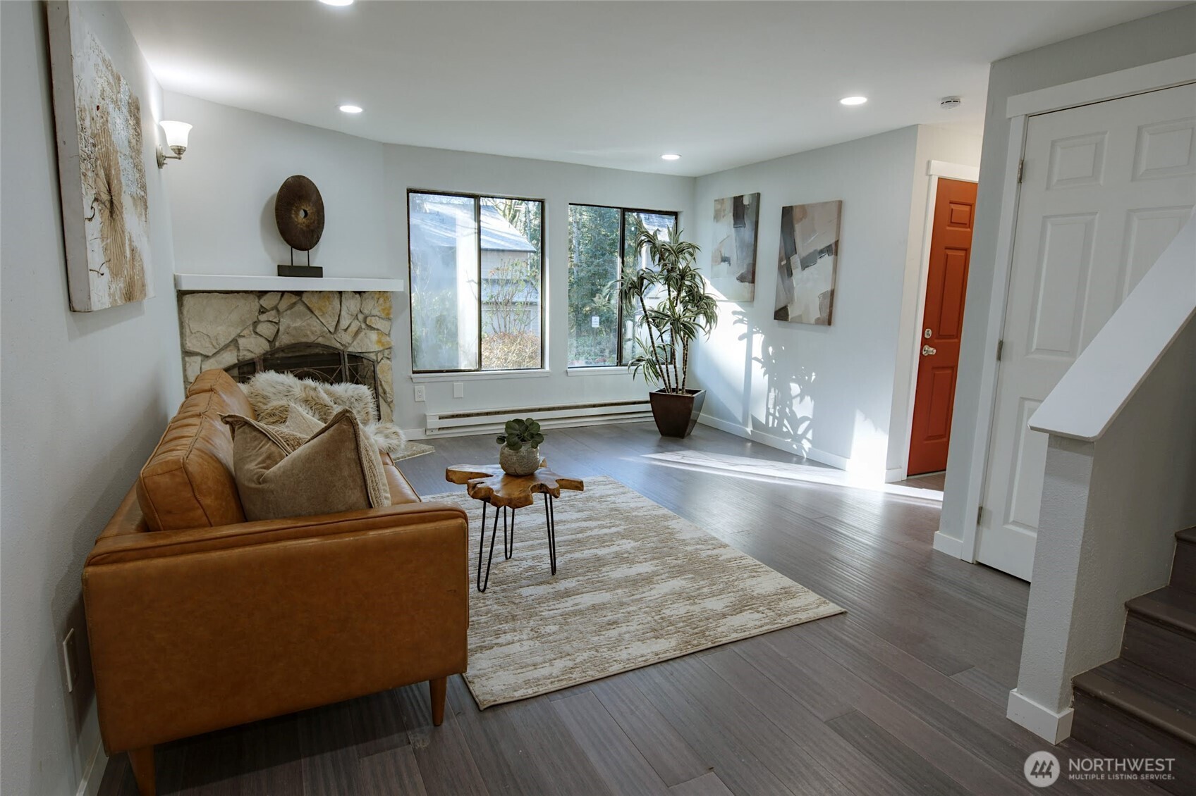 1555 Union Avenue Northeast, Unit G38 Renton, WA 98059 - Photo 3 of 18 a living room with furniture and a wooden floor