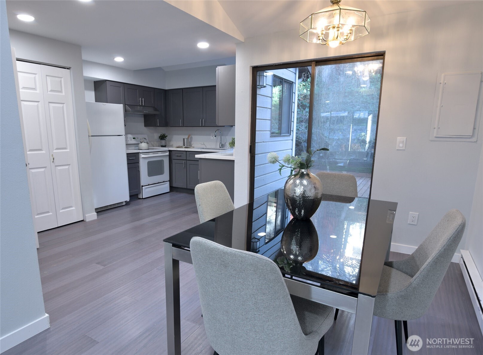 1555 Union Avenue Northeast, Unit G38 Renton, WA 98059 - Photo 7 of 18 a kitchen with stainless steel appliances granite countertop a refrigerator and a stove top oven