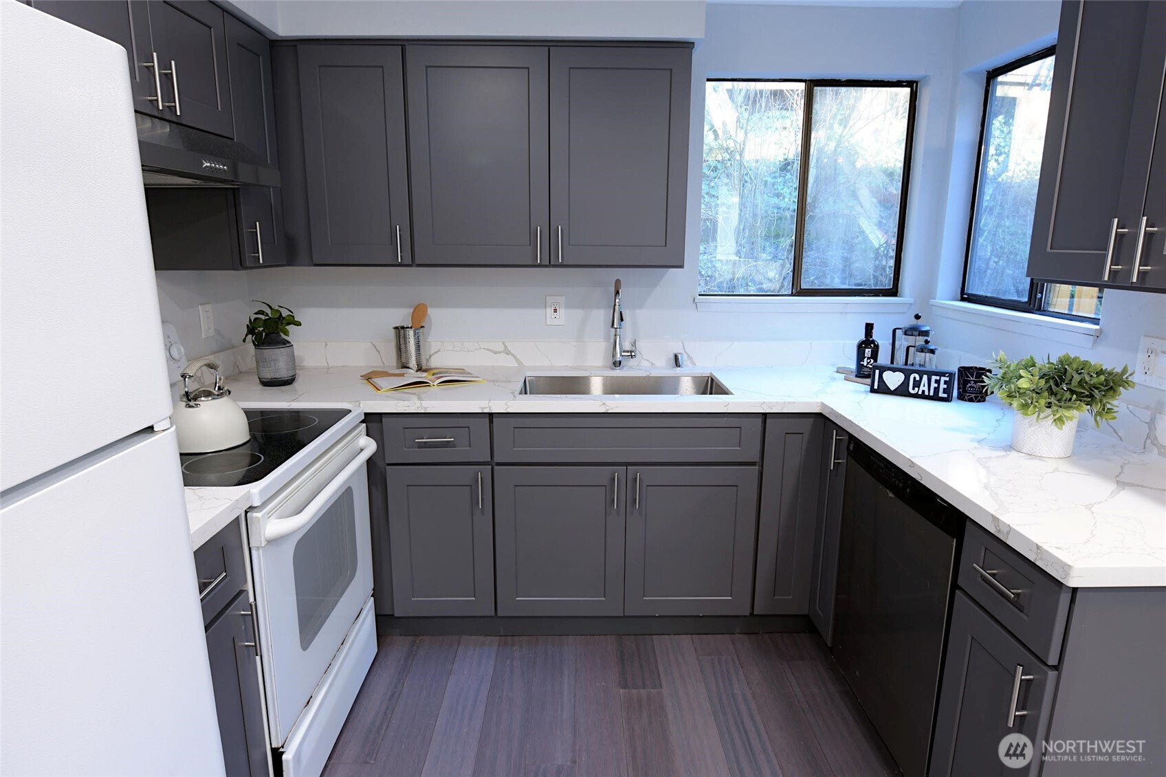 1555 Union Avenue Northeast, Unit G38 Renton, WA 98059 - Photo 8 of 18 a kitchen with a sink a stove and cabinets