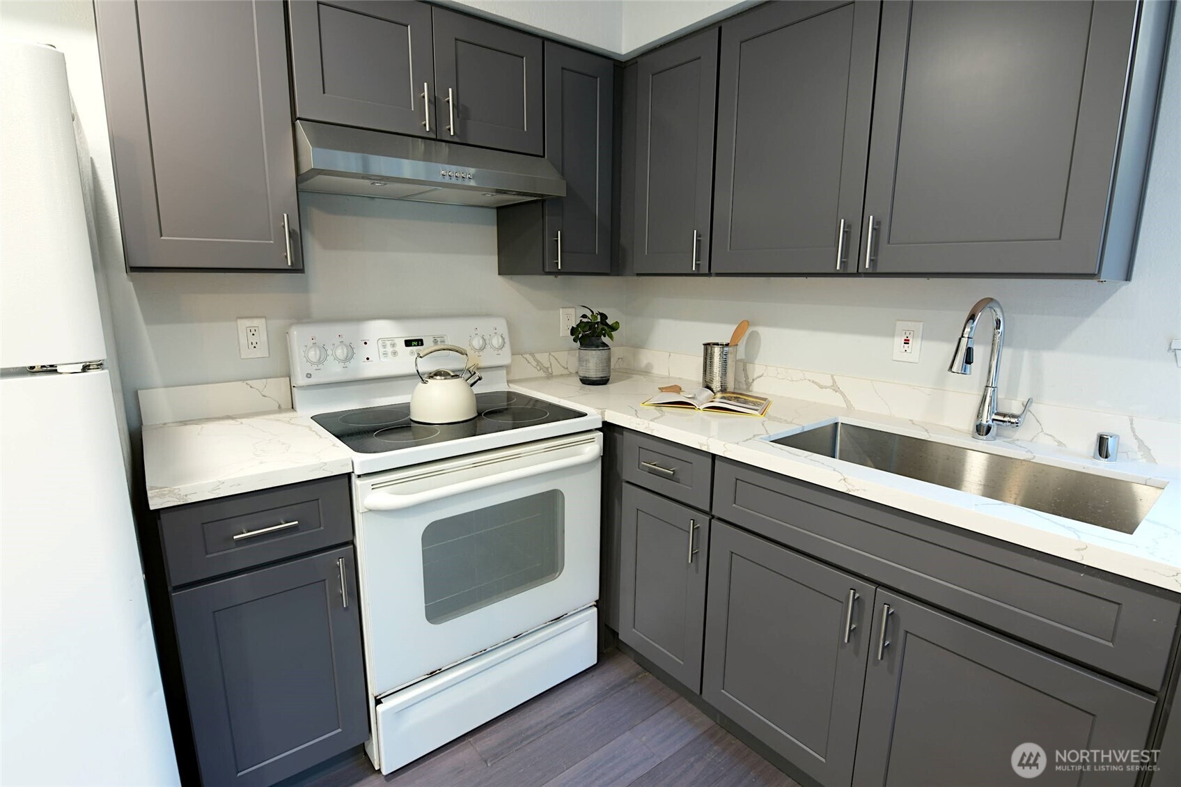1555 Union Avenue Northeast, Unit G38 Renton, WA 98059 - Photo 9 of 18 a kitchen with a sink cabinets and appliances