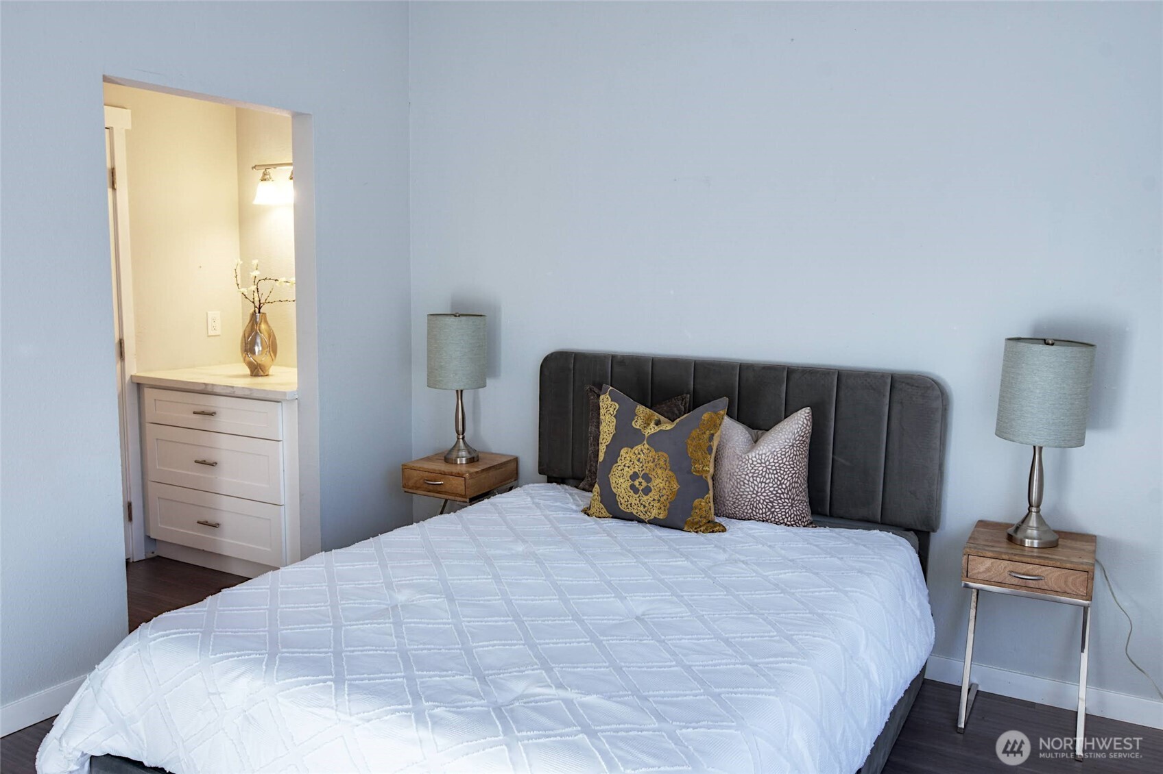 1555 Union Avenue Northeast, Unit G38 Renton, WA 98059 - Photo 10 of 18 a bedroom with a bed and wooden floor