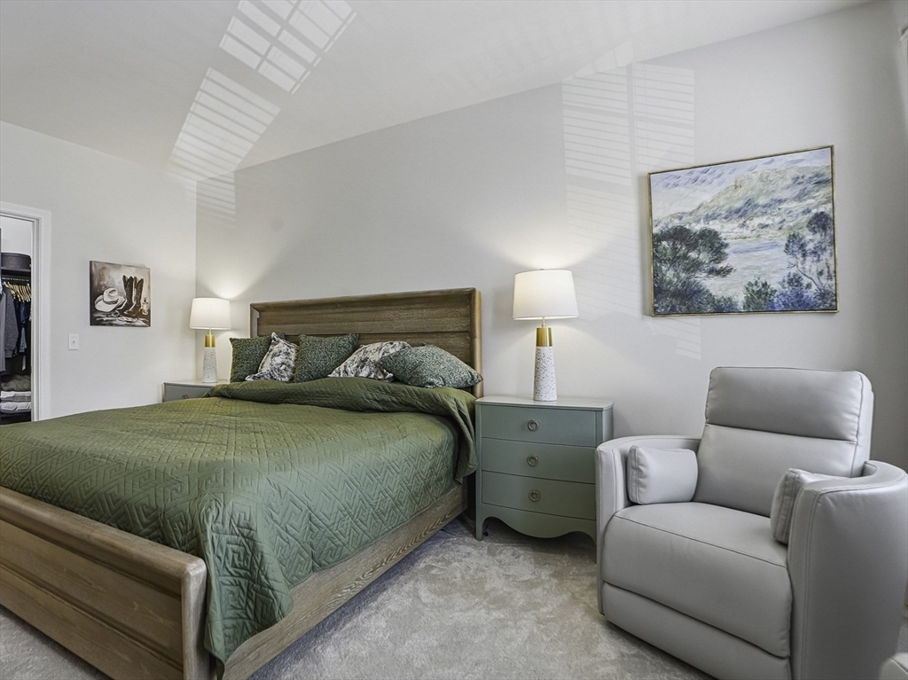 2 Codman Way, Unit 2203 Westborough, MA 01581 - Photo 15 of 36 a bedroom with a bed and a couch