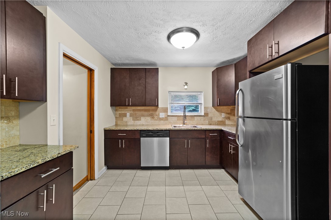 792 Miner Road Cleveland, OH 44143 - Photo 18 of 35 Updated Kitchen with stainelss appliances