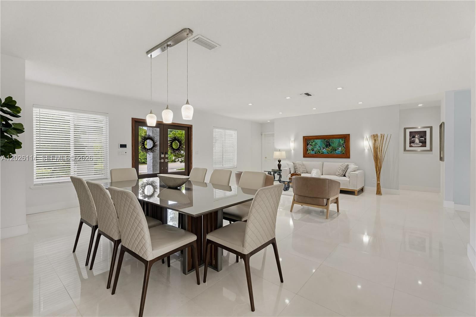 9641 Southwest 66th Street Miami, FL 33173 - Photo 13 of 57 a view of a dining room with furniture