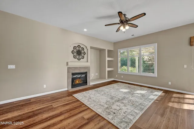 a view of a livingroom with furniture window and wooden floor