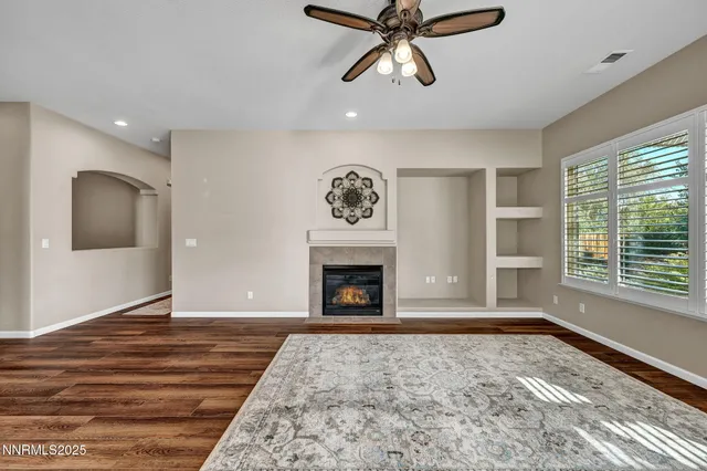 a view of a big room with closet and chandelier fan