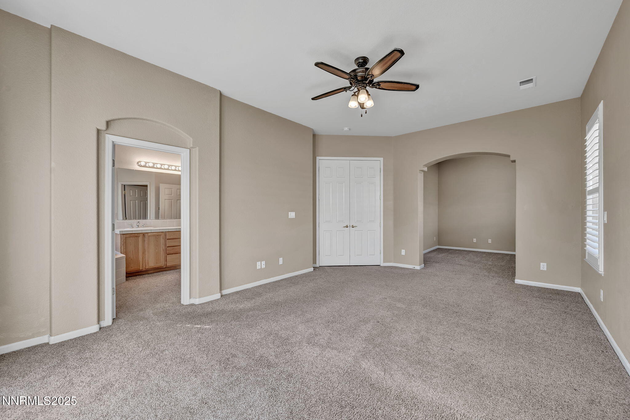 823 Gullane Court Dayton, NV 89403 - Photo 21 of 60 a view of a big room with closet and chandelier fan