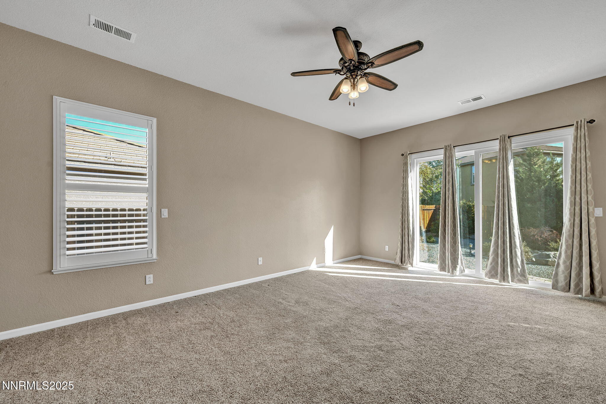 823 Gullane Court Dayton, NV 89403 - Photo 23 of 60 a view of a livingroom with a ceiling fan and window