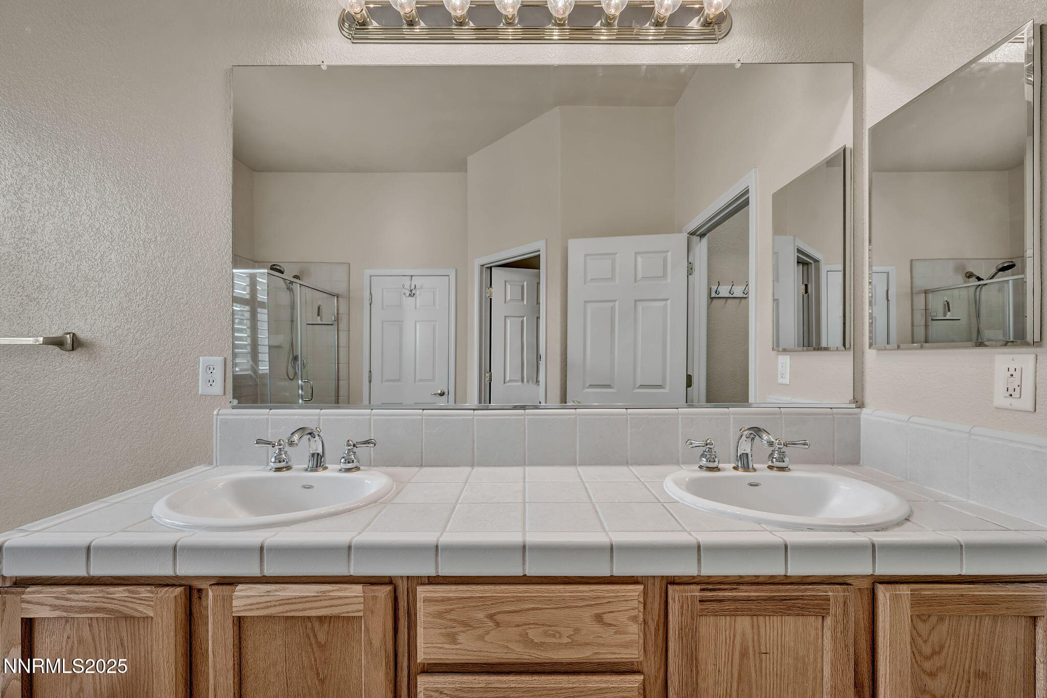 823 Gullane Court Dayton, NV 89403 - Photo 25 of 60 a bathroom with a sink double vanity and a mirror