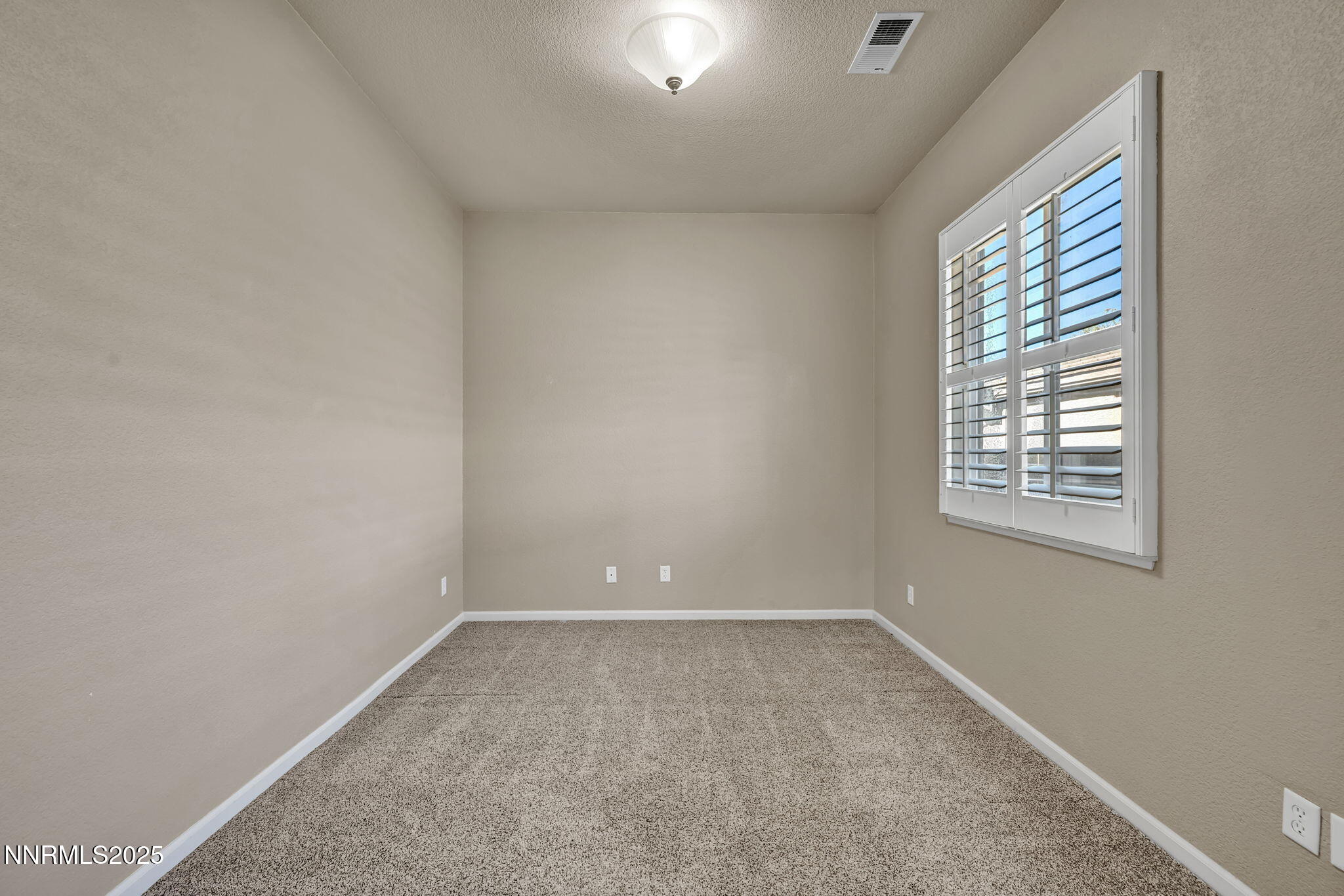 823 Gullane Court Dayton, NV 89403 - Photo 33 of 60 an empty room with windows