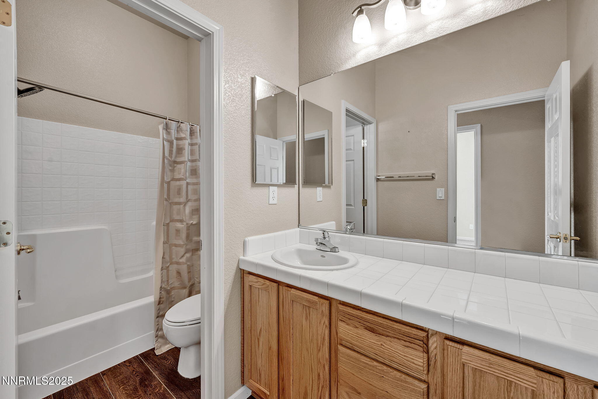 823 Gullane Court Dayton, NV 89403 - Photo 35 of 60 a bathroom with a sink a toilet and shower