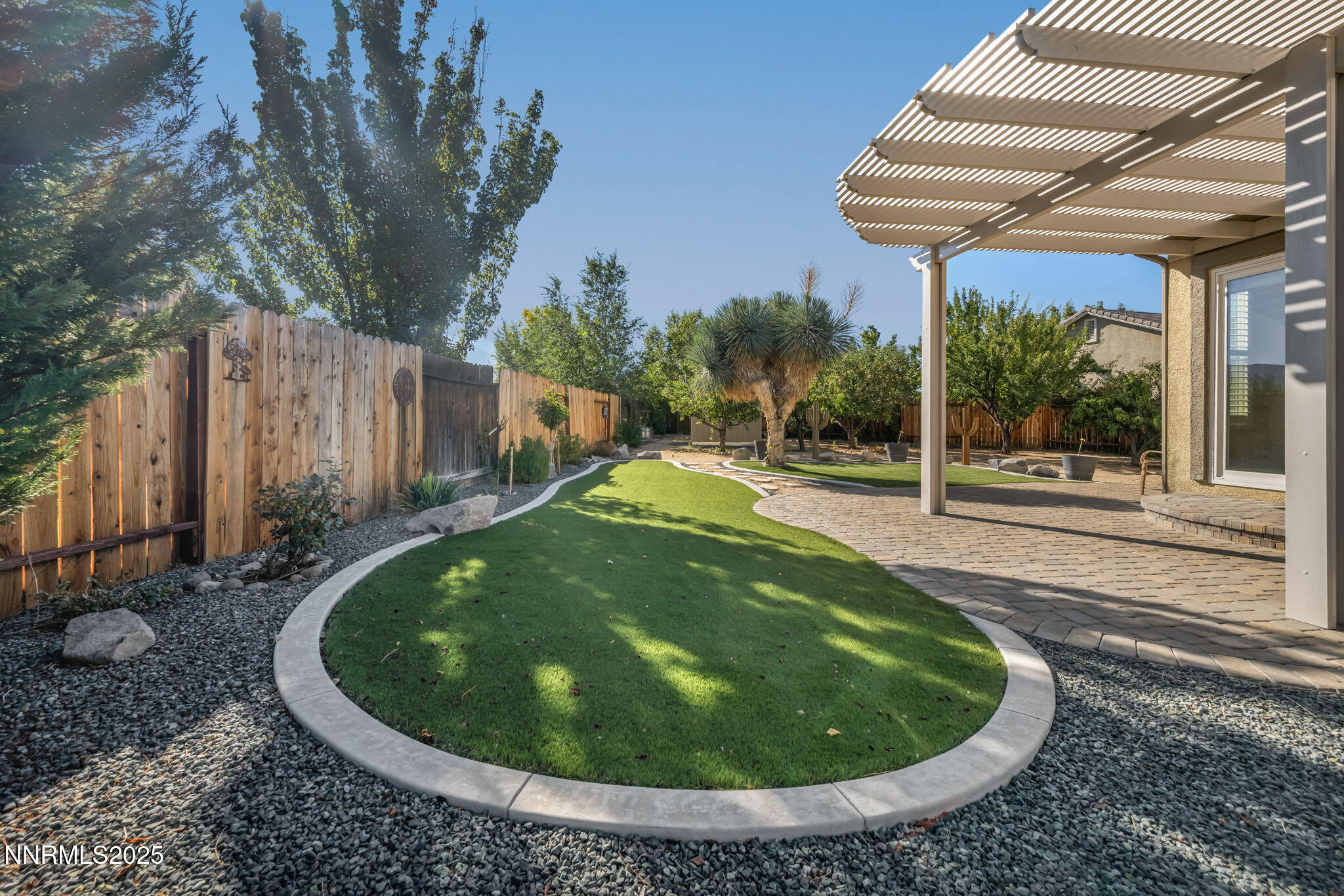 823 Gullane Court Dayton, NV 89403 - Photo 45 of 60 a view of a backyard with plants and a fountain