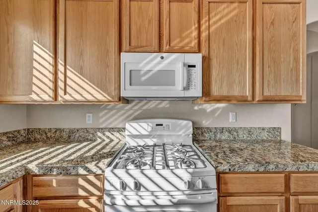a view of a dining room with furniture wooden floor and chandelier