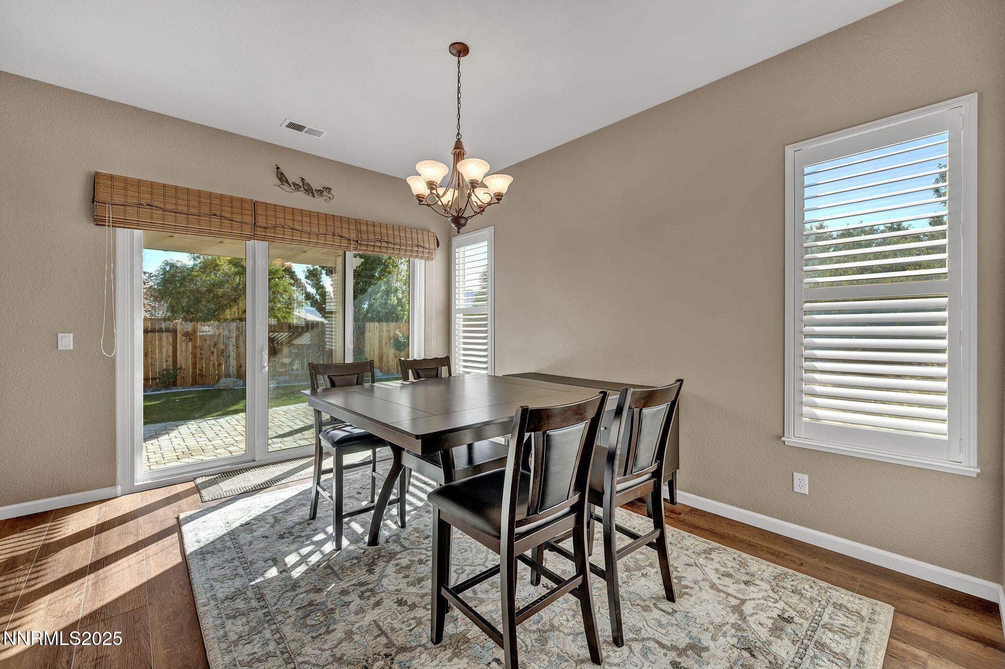 823 Gullane Court Dayton, NV 89403 - Photo 10 of 60 a view of a dining room with furniture wooden floor and chandelier