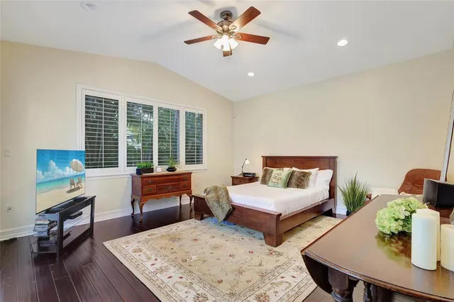 a bedroom with two beds and a large window