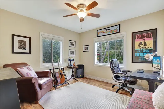 a view of a livingroom with workspace and a couch