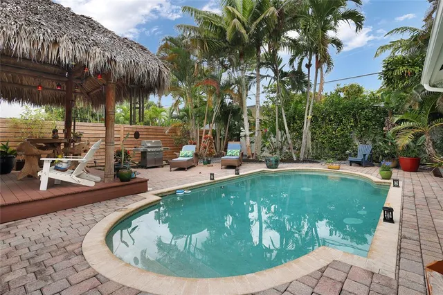 a view of a swimming pool with a sitting area
