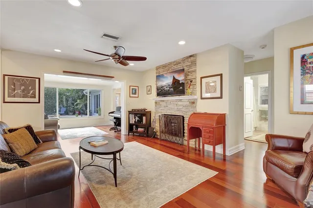 a living room with furniture a fireplace and a table