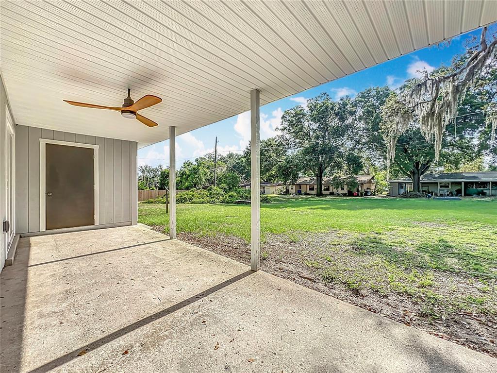 1305 Eagleview Drive Brandon, FL 33510 - Photo 22 of 27 a view of a house with backyard and a garden
