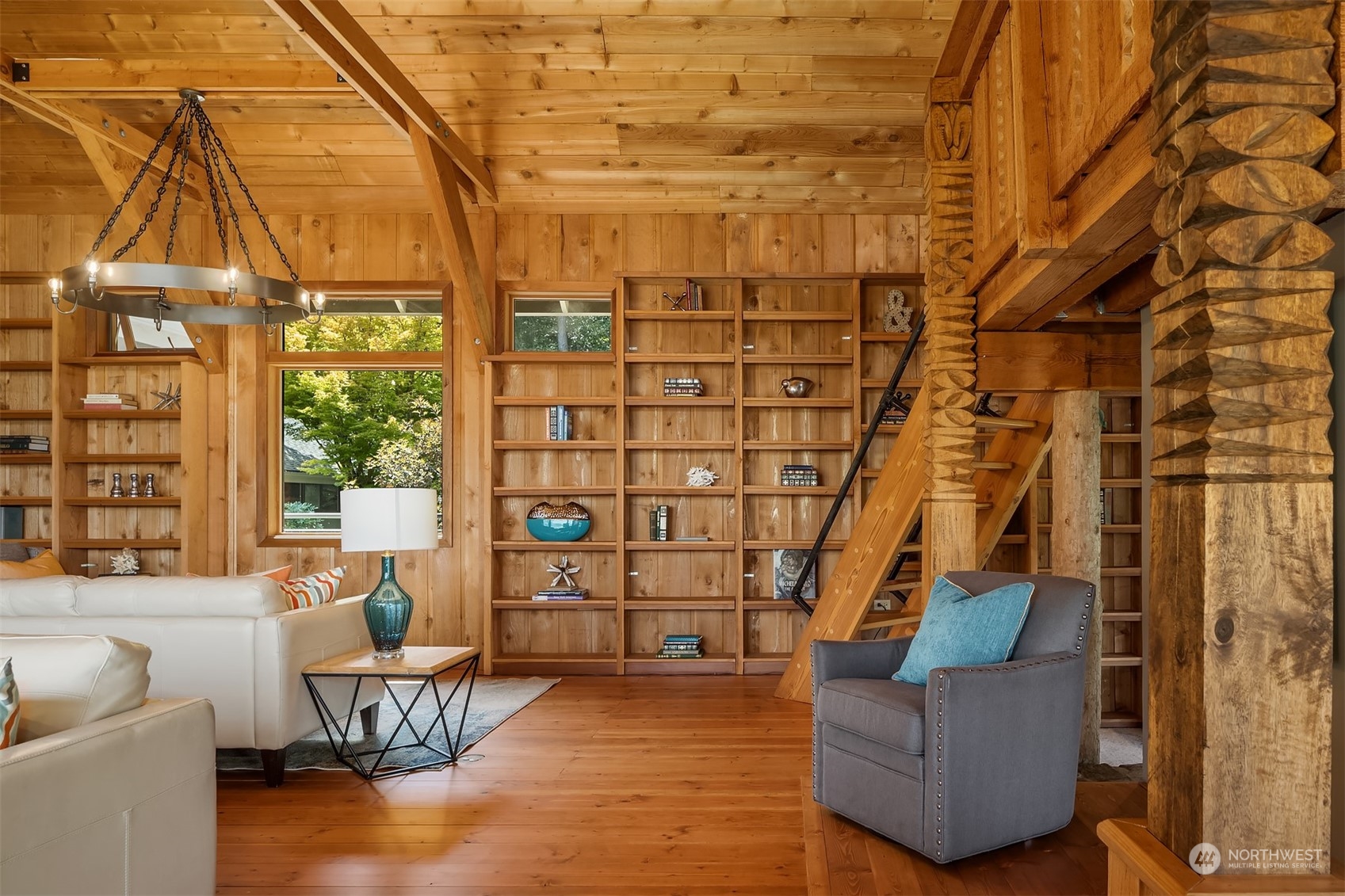 378 Smugglers Cove Road Shaw Island, WA 98286 - Photo 13 of 40 a living room with furniture and a floor to ceiling window