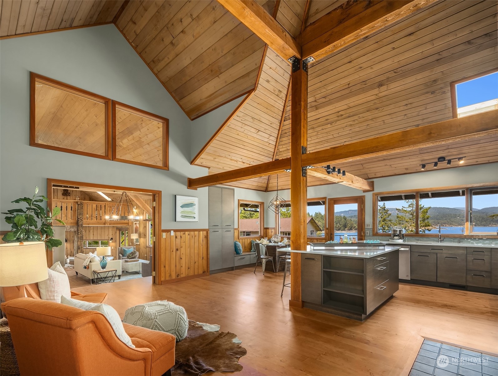 378 Smugglers Cove Road Shaw Island, WA 98286 - Photo 16 of 40 a living room with furniture and a large window