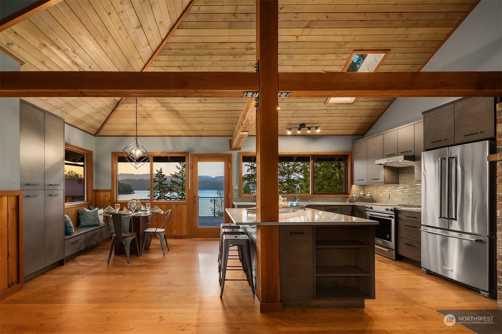 378 Smugglers Cove Road Shaw Island, WA 98286 - Photo 18 of 40 a kitchen with stainless steel appliances granite countertop a refrigerator a stove and a wooden cabinets