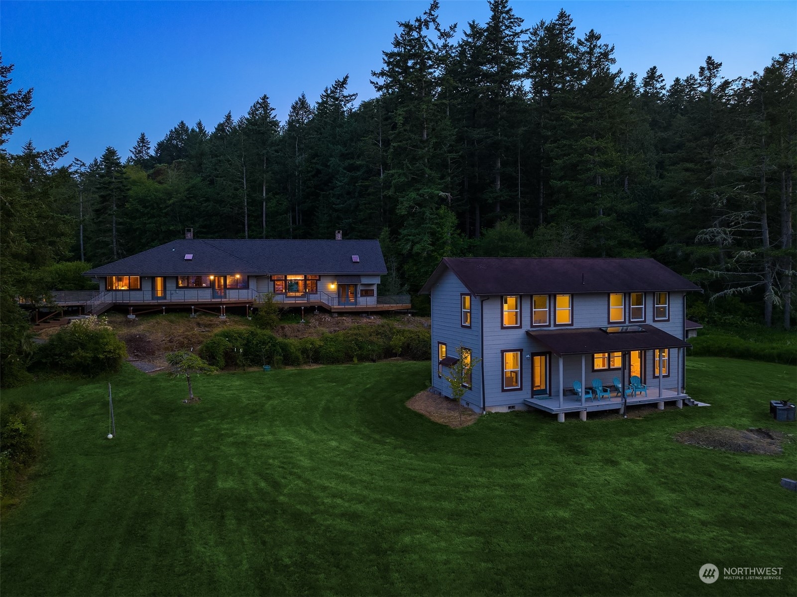 378 Smugglers Cove Road Shaw Island, WA 98286 - Photo 2 of 40 a view of a house with a yard table and chairs