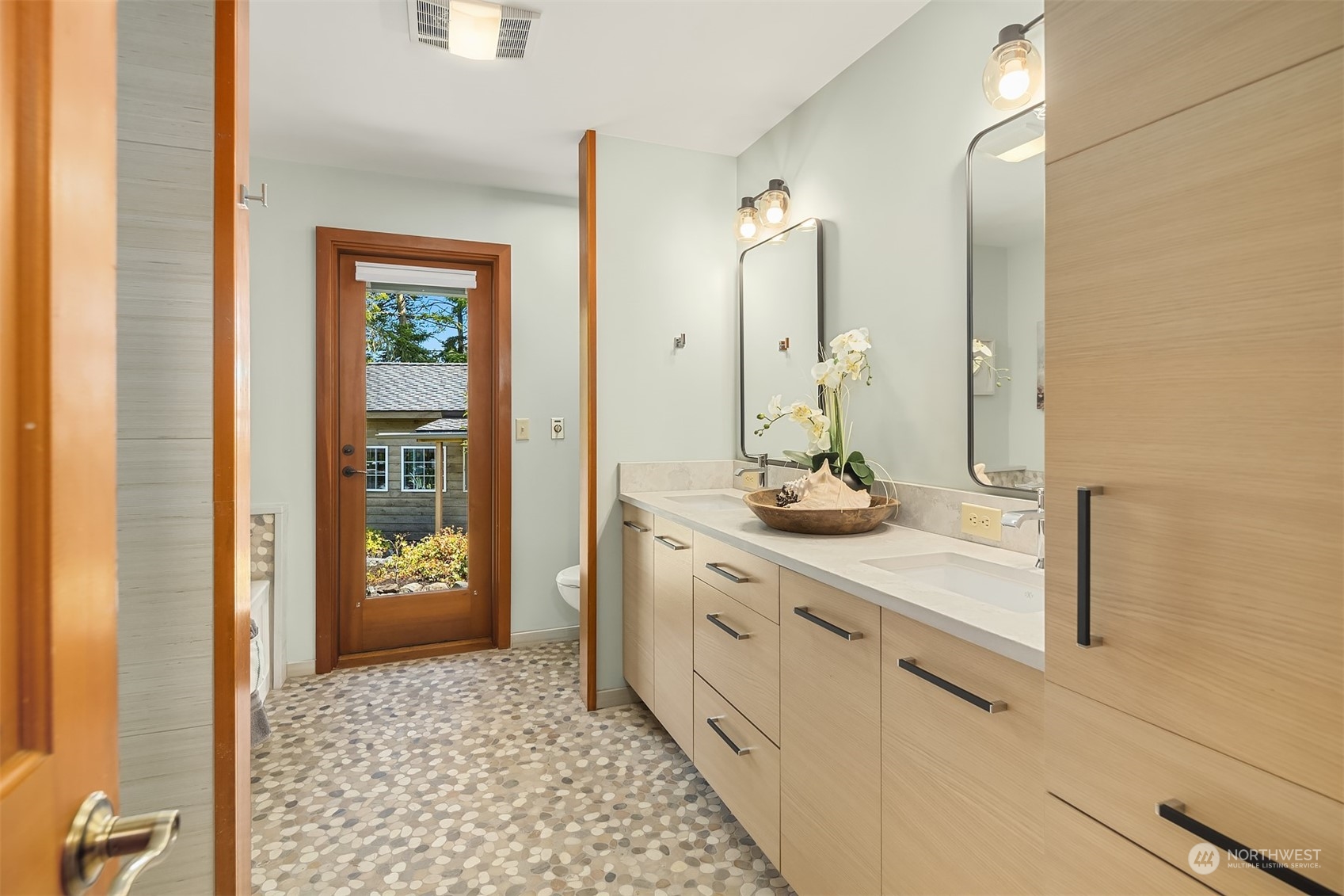 378 Smugglers Cove Road Shaw Island, WA 98286 - Photo 21 of 40 a bathroom with a granite countertop sink and a mirror