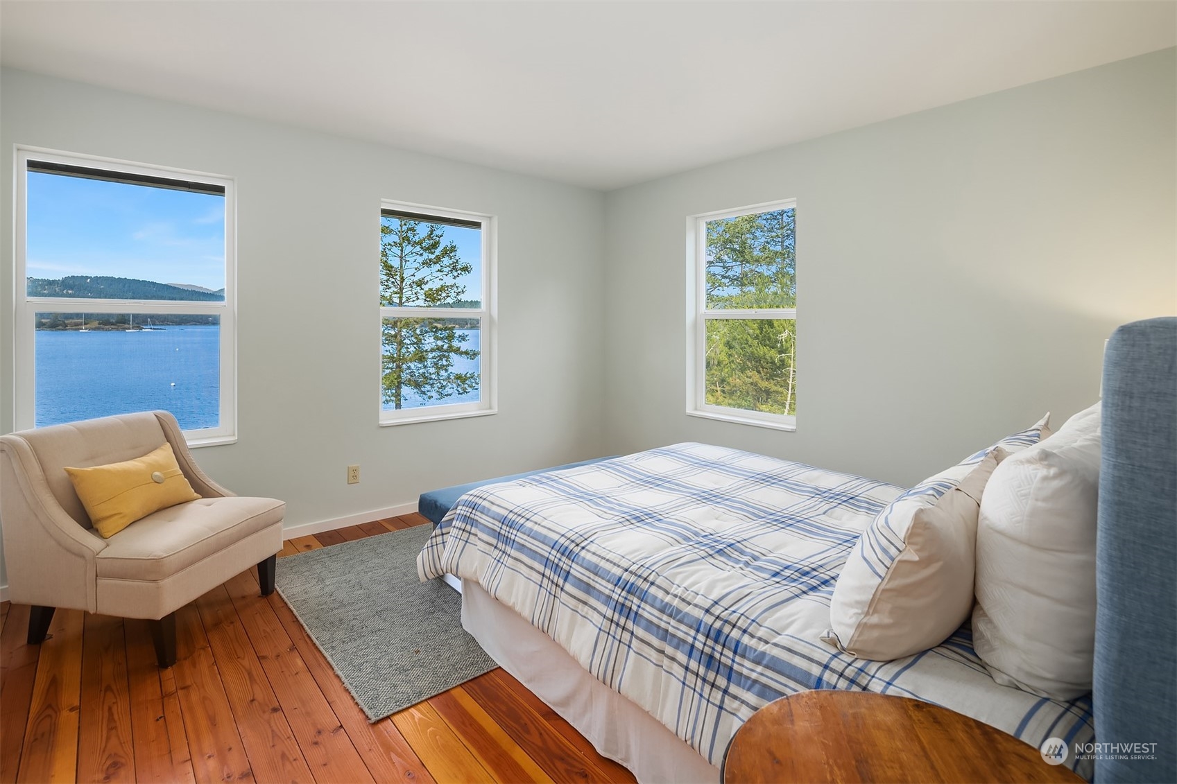 378 Smugglers Cove Road Shaw Island, WA 98286 - Photo 30 of 40 a bedroom with a bed and a couch