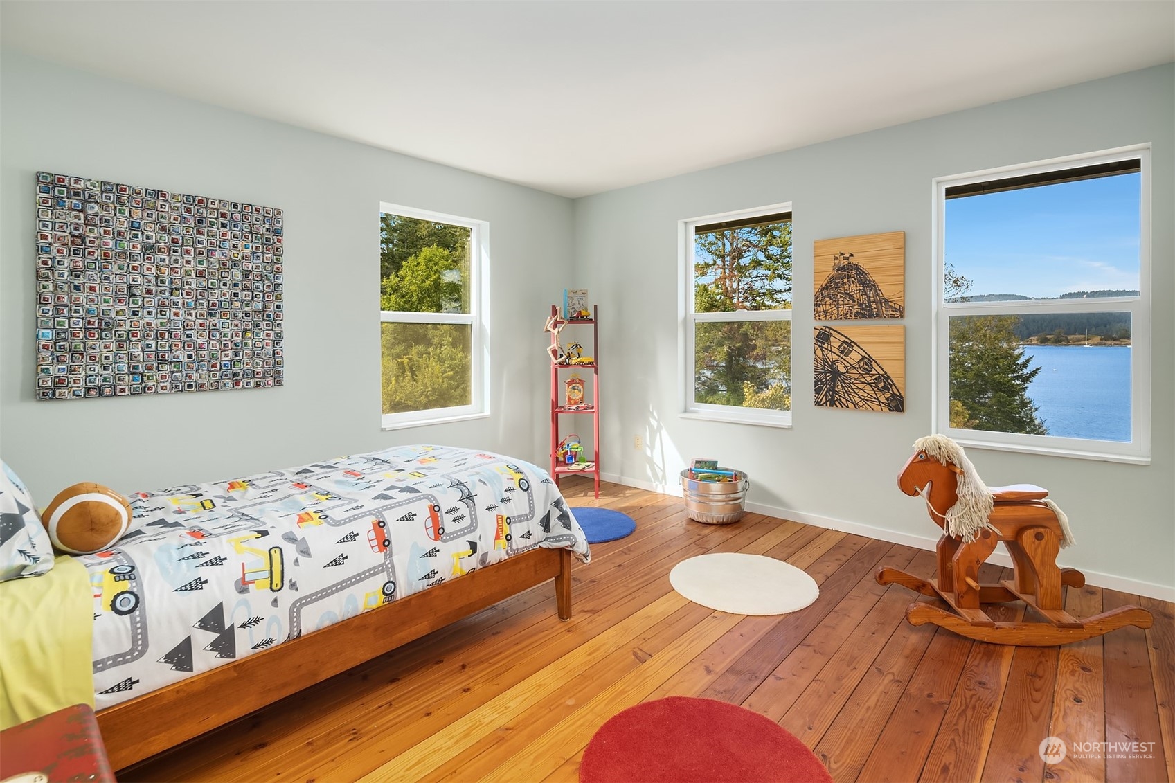 378 Smugglers Cove Road Shaw Island, WA 98286 - Photo 31 of 40 a bedroom with a bed and wooden floor