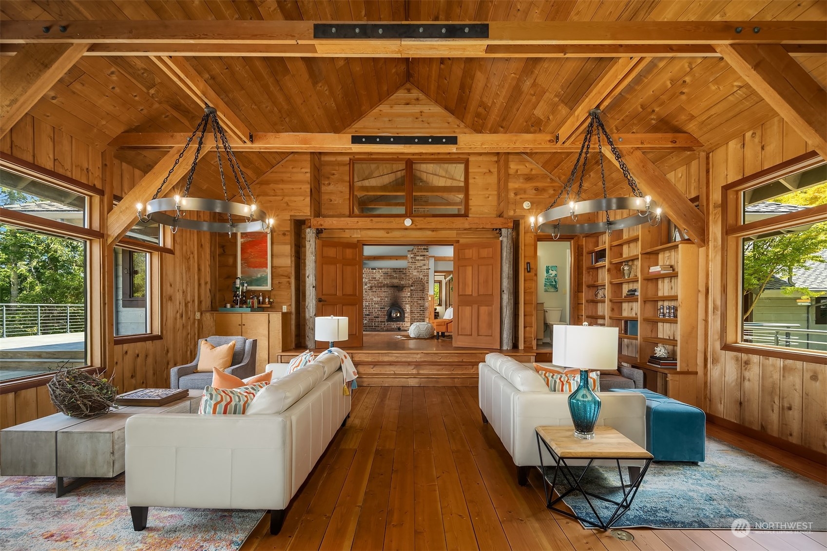 378 Smugglers Cove Road Shaw Island, WA 98286 - Photo 8 of 40 a living room with furniture a window and a chandelier
