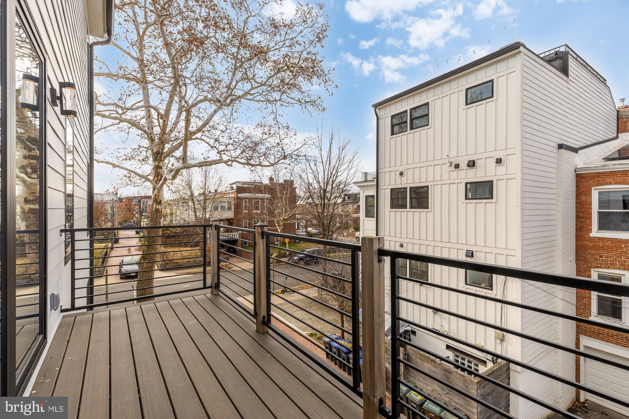641 Quebec Place Northwest, Unit 2 Washington, DC 20010 - Photo 11 of 32 a view of a balcony with wooden floor and fence