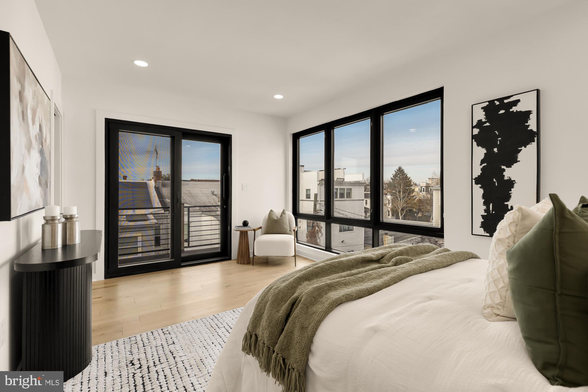 641 Quebec Place Northwest, Unit 2 Washington, DC 20010 - Photo 19 of 32 a bedroom with a large bed and a large window