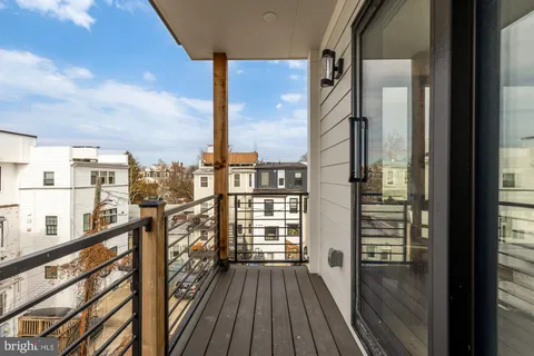 a view of a balcony with wooden floor