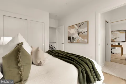 a view of a bedroom with wooden floor and bedroom