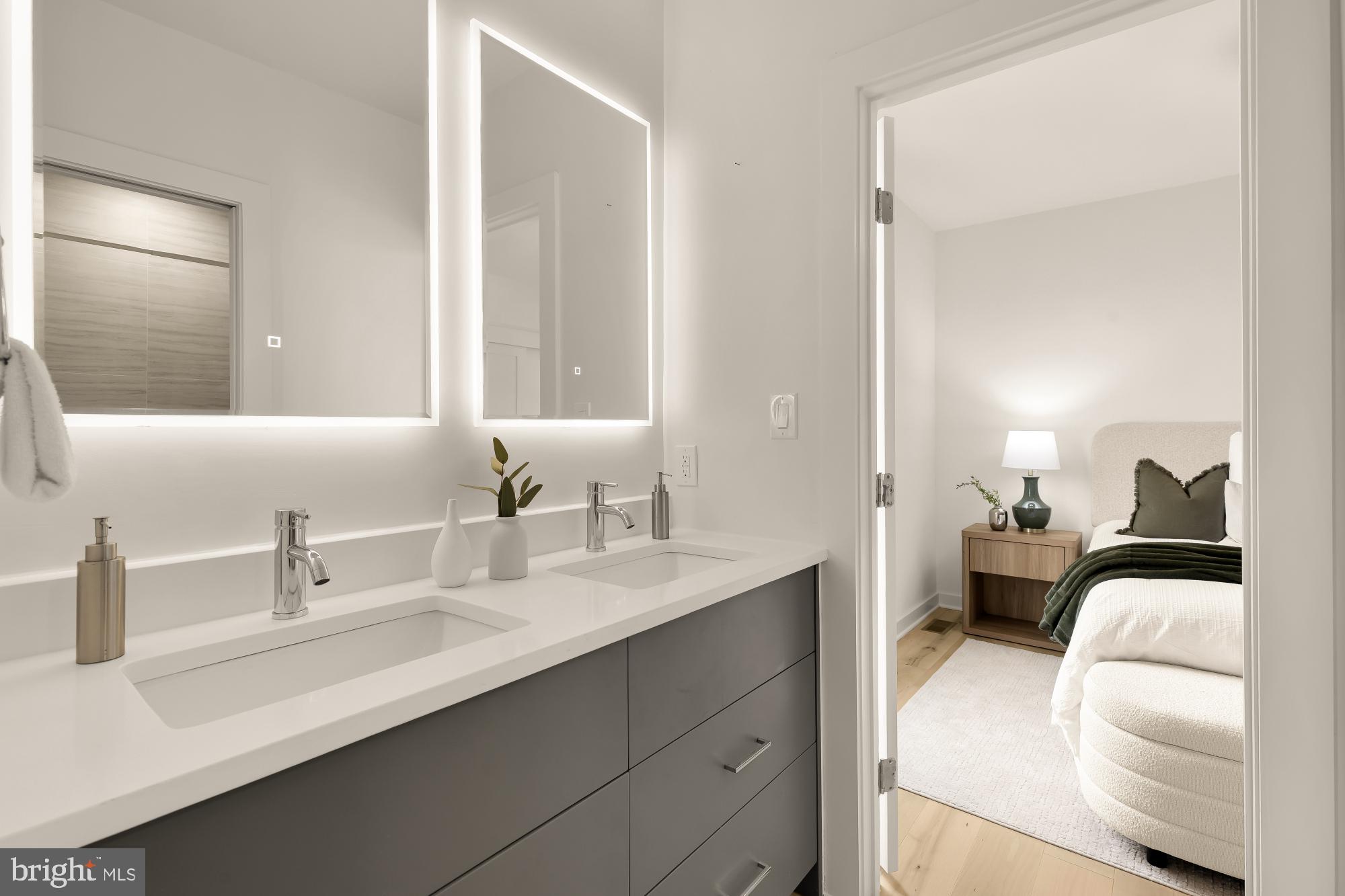 641 Quebec Place Northwest, Unit 2 Washington, DC 20010 - Photo 26 of 32 a en suite bathroom with a double vanity sink and a mirror