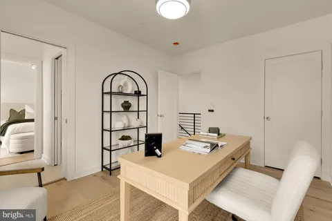 a view of kitchen island with furniture and wooden floor