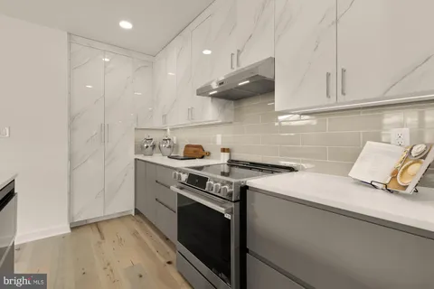 a kitchen with a stove and a sink