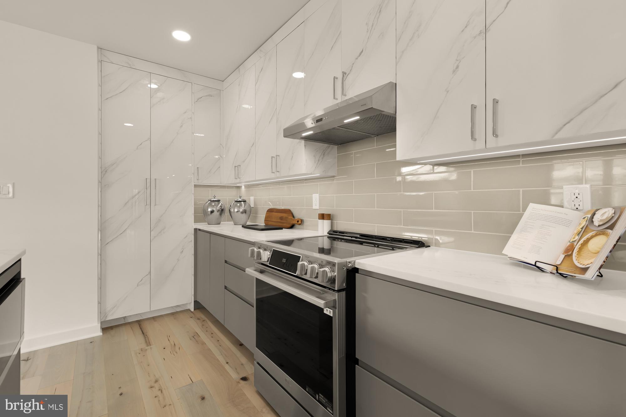 641 Quebec Place Northwest, Unit 2 Washington, DC 20010 - Photo 9 of 32 a kitchen with a stove and a sink