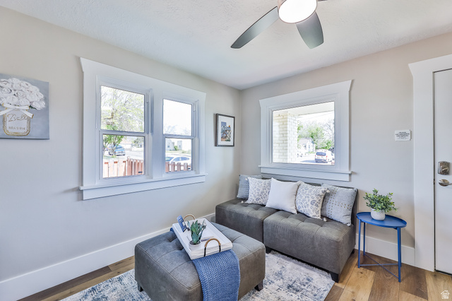 59 East 8680th Street South Sandy, UT 84070 - Photo 3 of 33 Bright room featuring light-toned walls, wood-finish flooring, and white trim