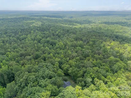 a view of a field with an trees